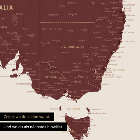 Ausschnitt einer Landkarte von Australien in Farbe Bordeaux Rot mit Pins zur Markierung von besuchten Reisezielen