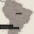 Detail einer Weltkarte als Pinn-Leinwand in Warmgray (Braun-Grau) mit Pins, die eine abgesteckte Reiseroute in Südamerika durch die Länder Brasilien, Peru und Ecuador zeigt